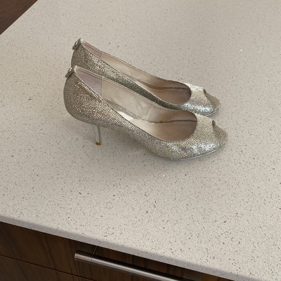 Michael Kors Collection Shoes - Michael kors size 9 ., silver Worn a few times . Slightly used in the front.